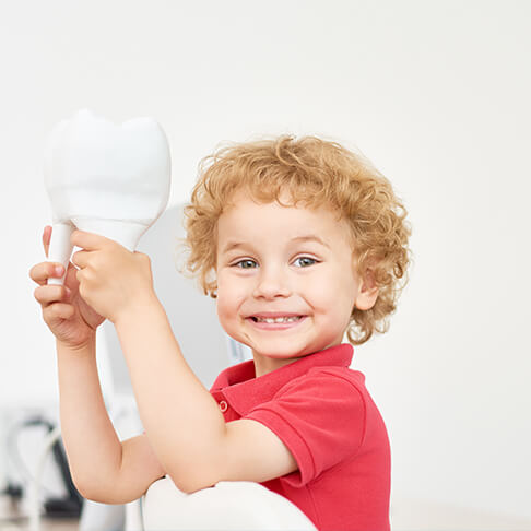 toddler with a giant tooth